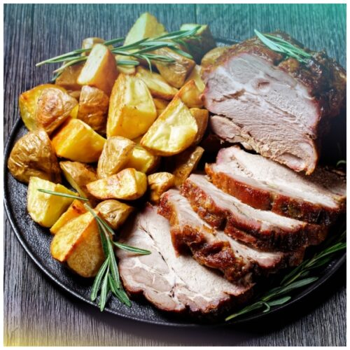 Arista di maiale arrosto con mele renette, zucca, patate ed erbe aromatiche